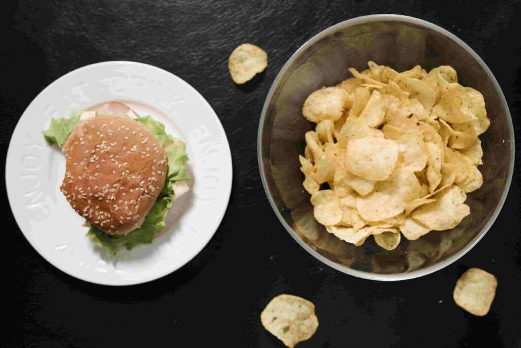 Healthy alternatives to junk food including fresh fruits, vegetables, nuts, and nutritious snacks