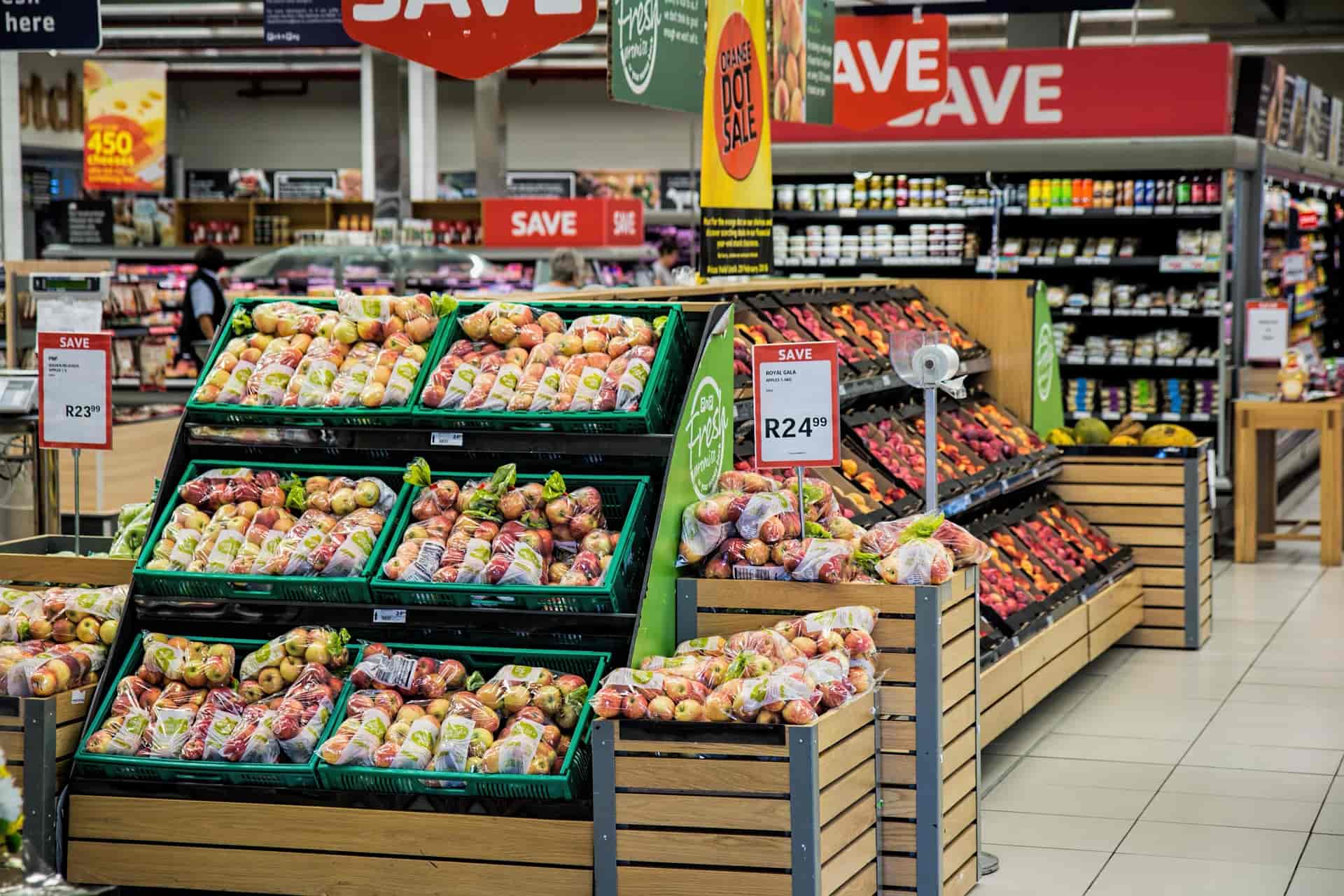 Healthy grocery shopping basket filled with fresh fruits, vegetables, whole grains, and nutritious foods